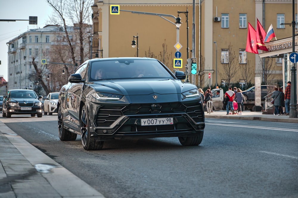 black mercedes benz car on road during daytime