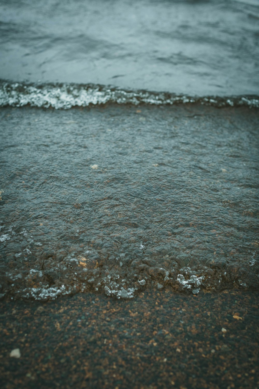 water waves on the shore during daytime