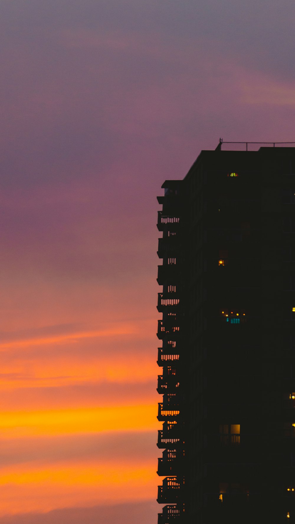 silhouette of building during sunset