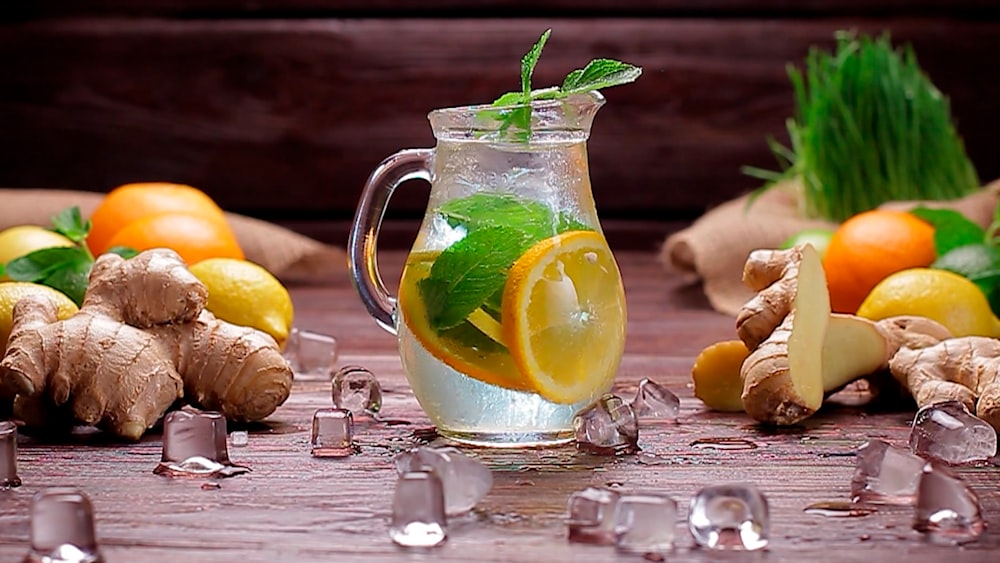 clear glass pitcher with lemon juice