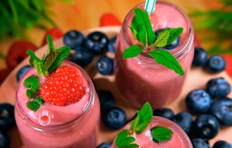 strawberry shake on clear drinking glass