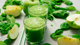 green liquid in clear drinking glass