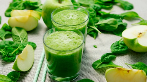 green liquid in clear drinking glass