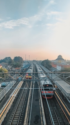 red and black train on rail during daytime