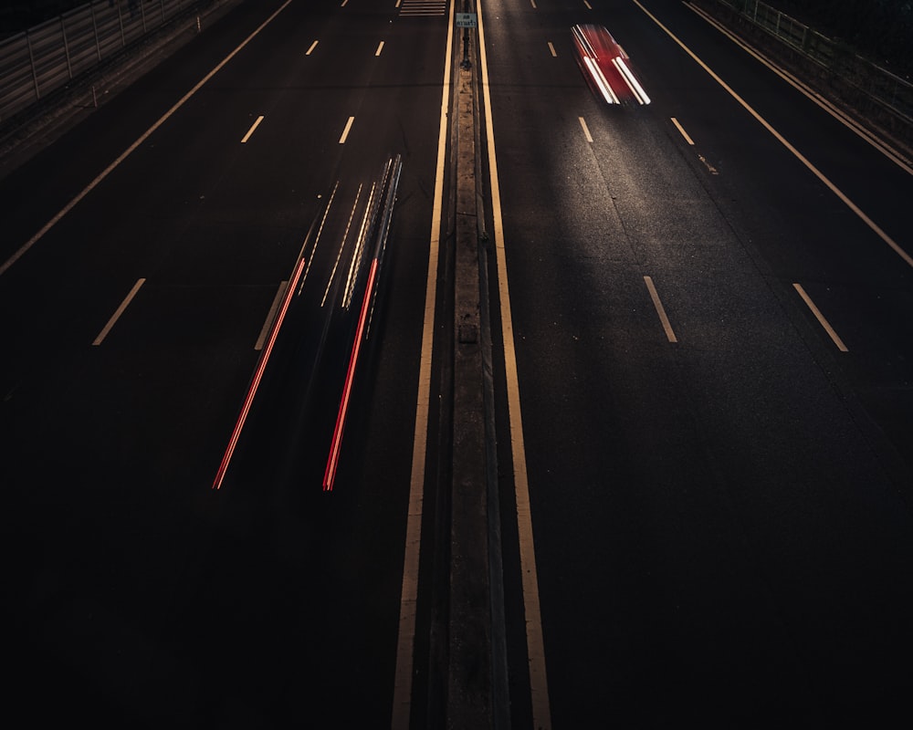 time lapse photography of cars on road during night time