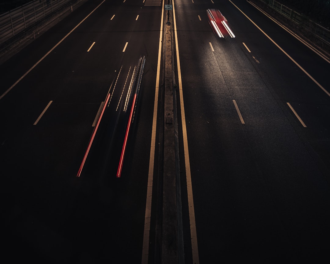 time lapse photography of cars on road during night time