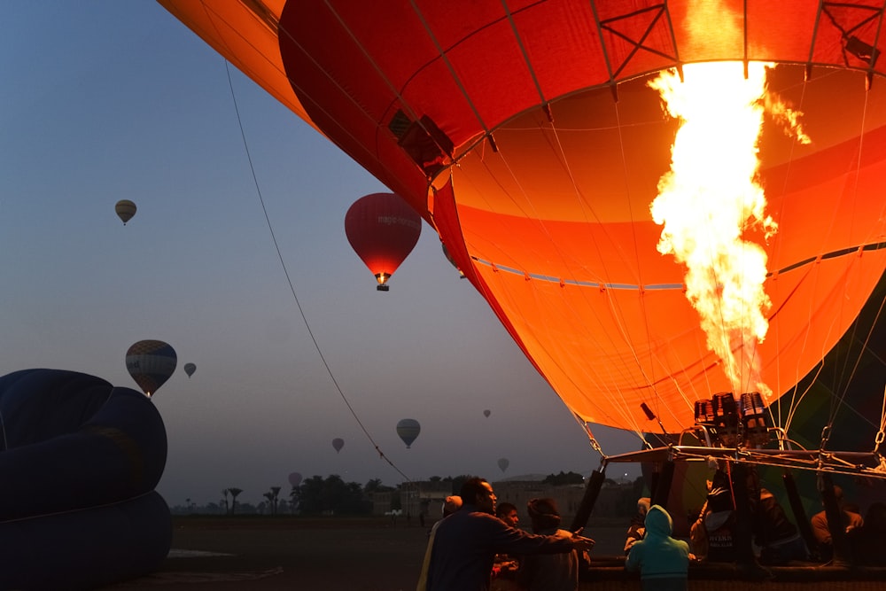 people in hot air balloon during daytime