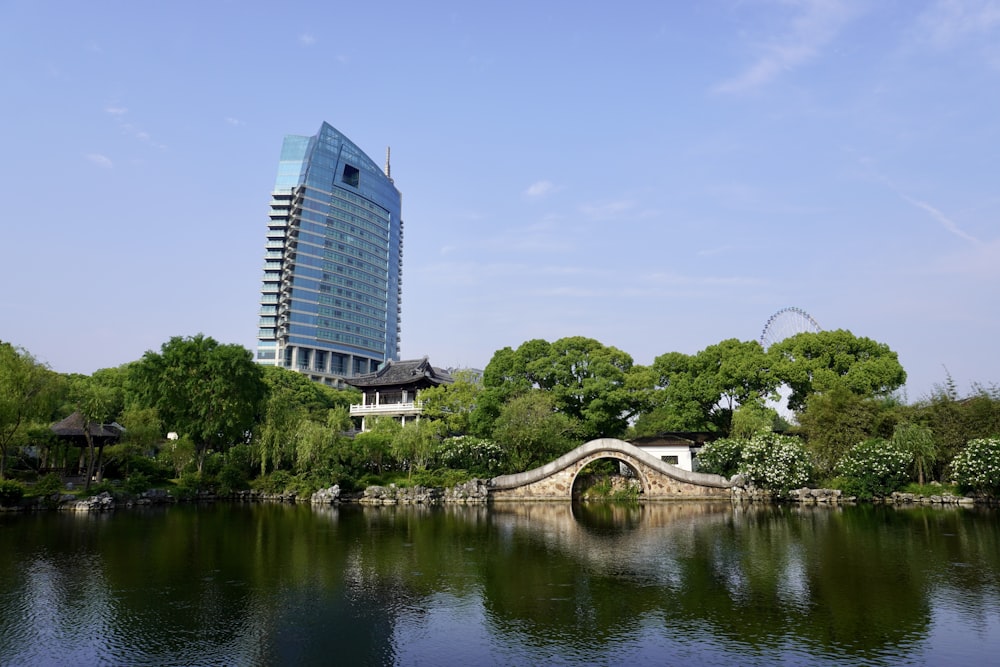 white concrete building near river during daytime