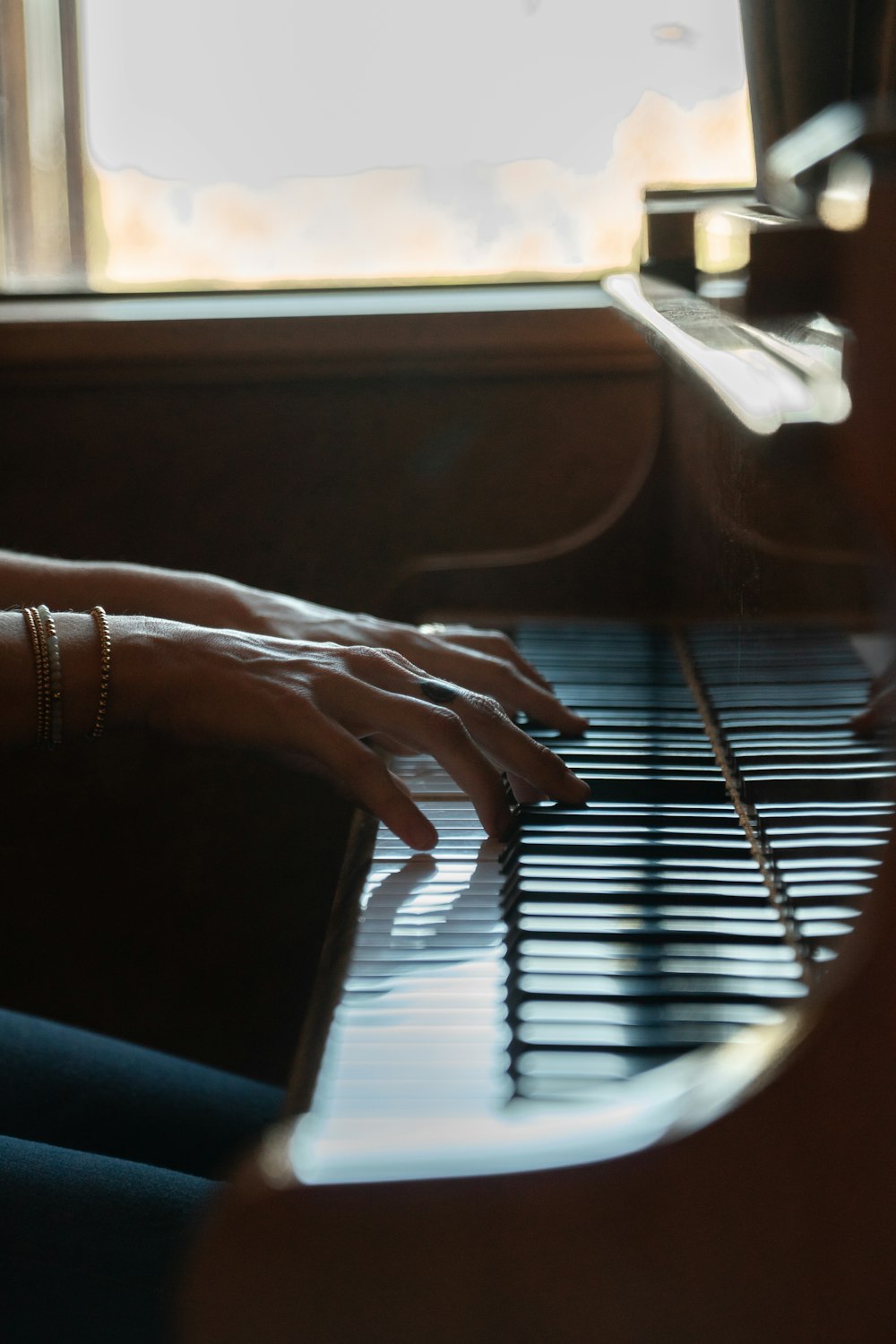 person playing piano during daytime