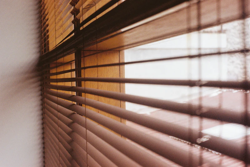 Warm timber-tone blinds filtering afternoon light