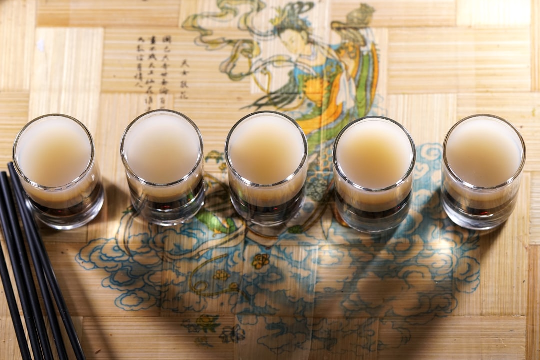 3 clear drinking glasses on brown wooden table