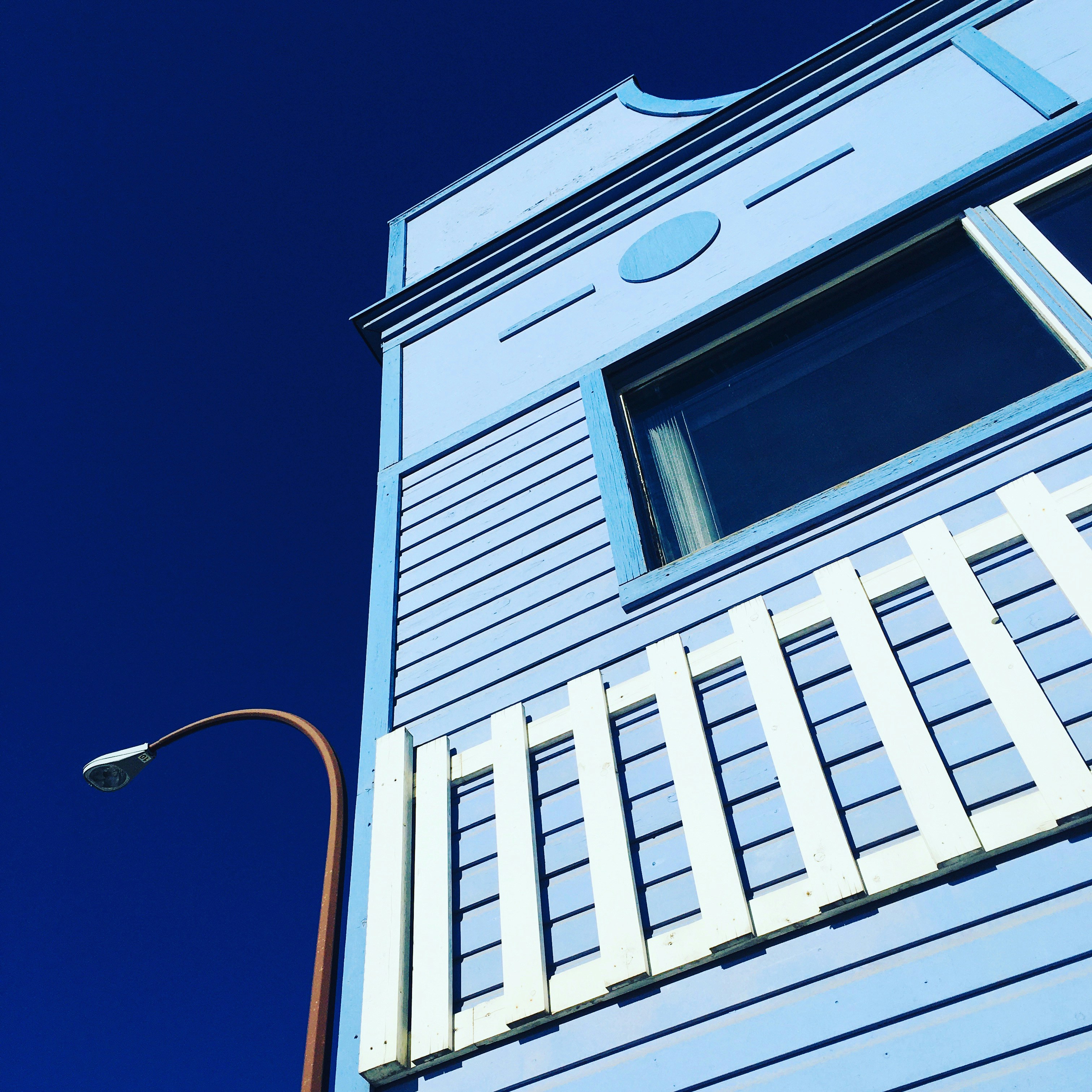 white concrete building under blue sky during daytime