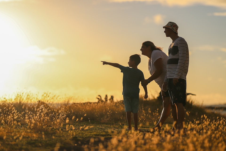 A family on their farm during sunset