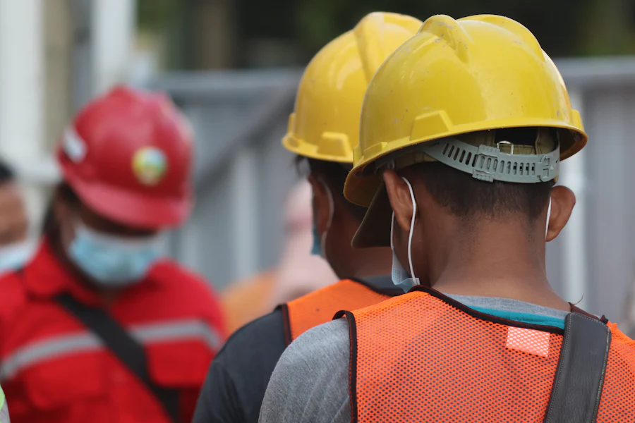 Safety consultant reviewing documentation with a plant supervisor