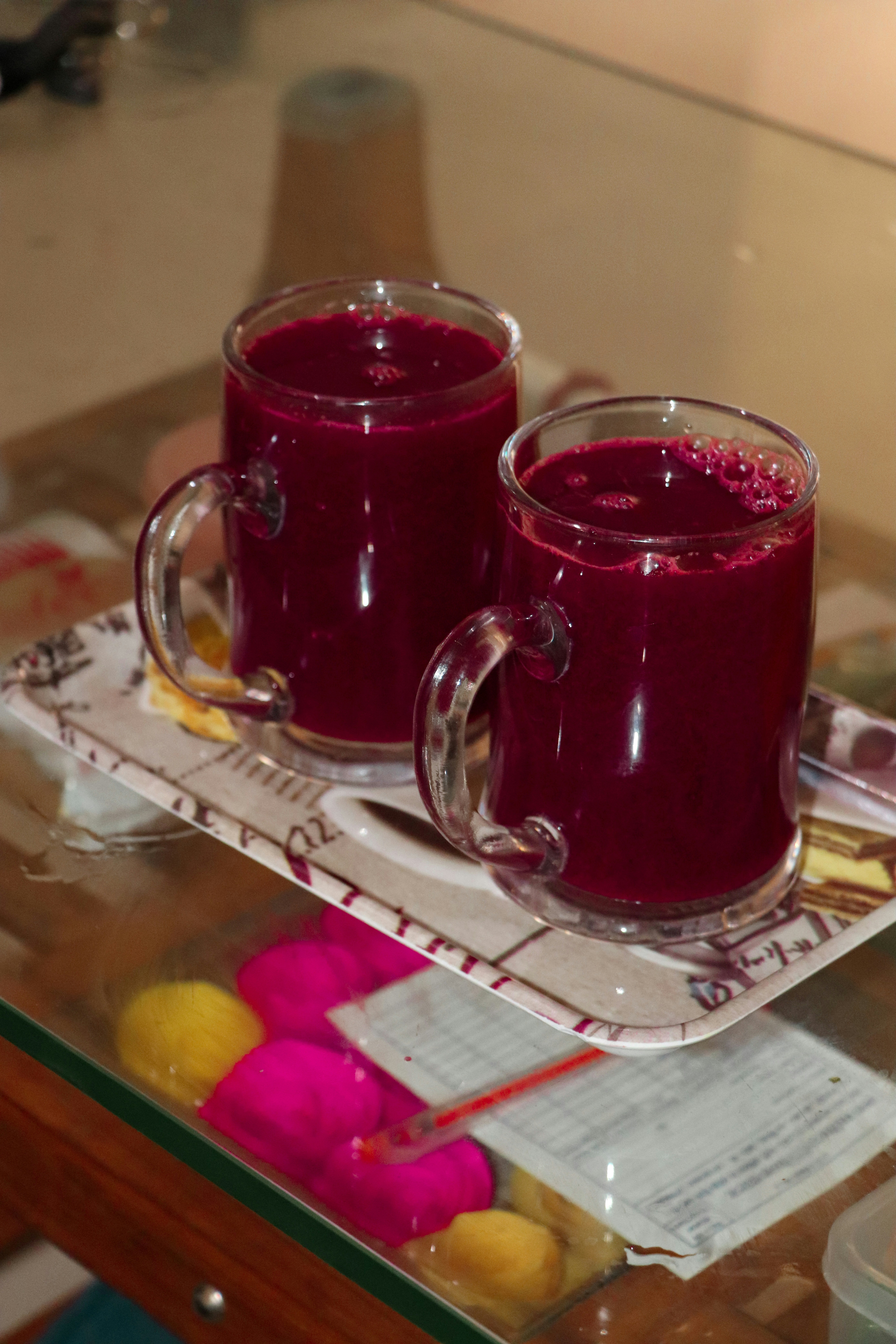 clear glass mug on stainless steel tray