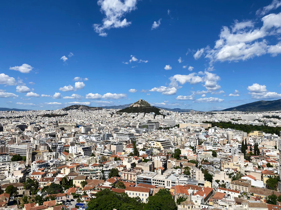 Athens spreading to the hills under a wide sky. The former airport lies south of this view.