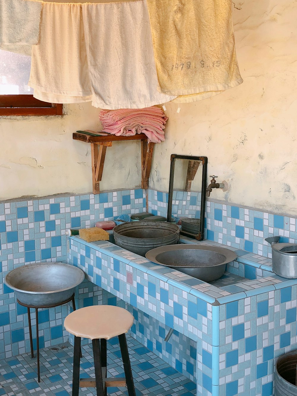 blue and white ceramic bowl on blue and white ceramic tiles