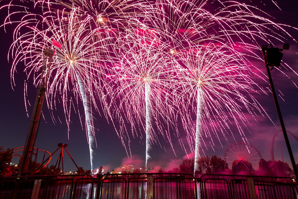 fireworks display over the city during night time