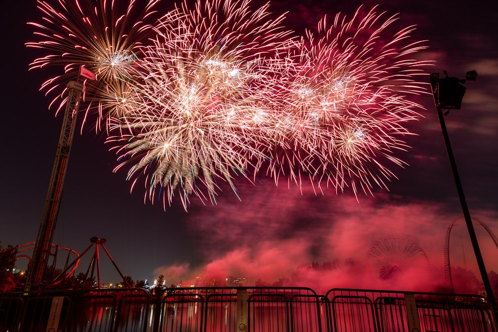 fireworks display over the city during night time