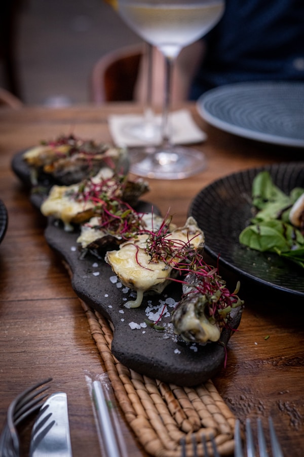 Vegetable salad on black ceramic plate