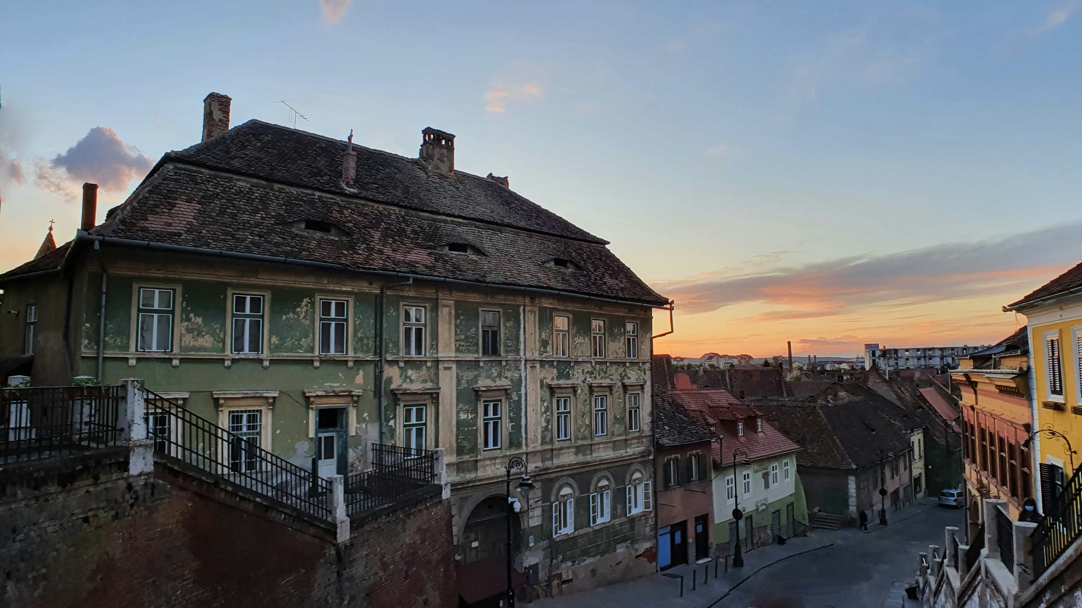 brown and white concrete building during daytime