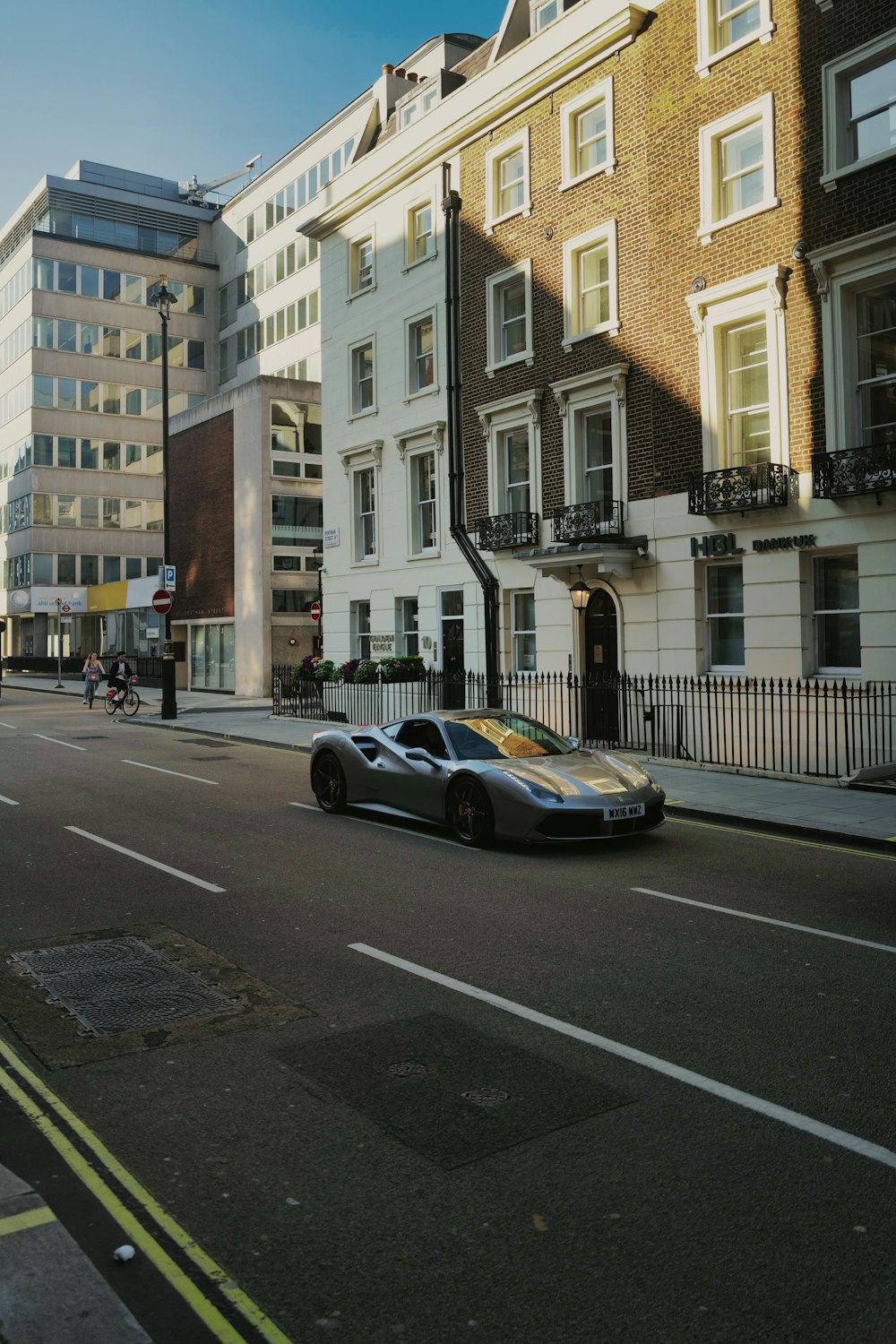 black coupe on road near building during daytime