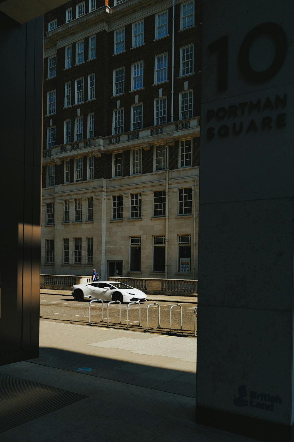 white horse statue near building during daytime