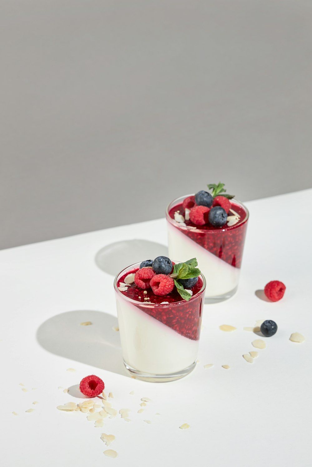 strawberry and blackberry in clear drinking glass