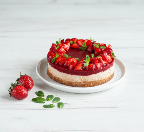 strawberry cake on white ceramic plate