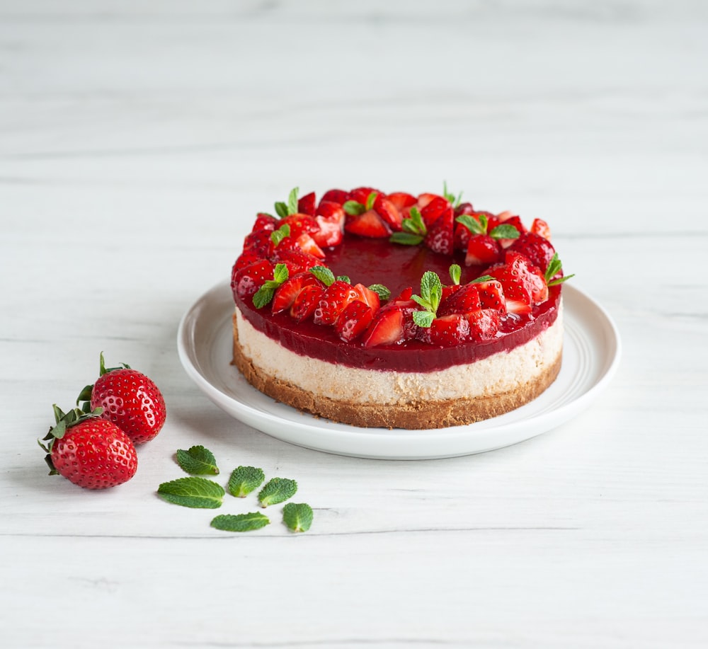 strawberry cake on white ceramic plate