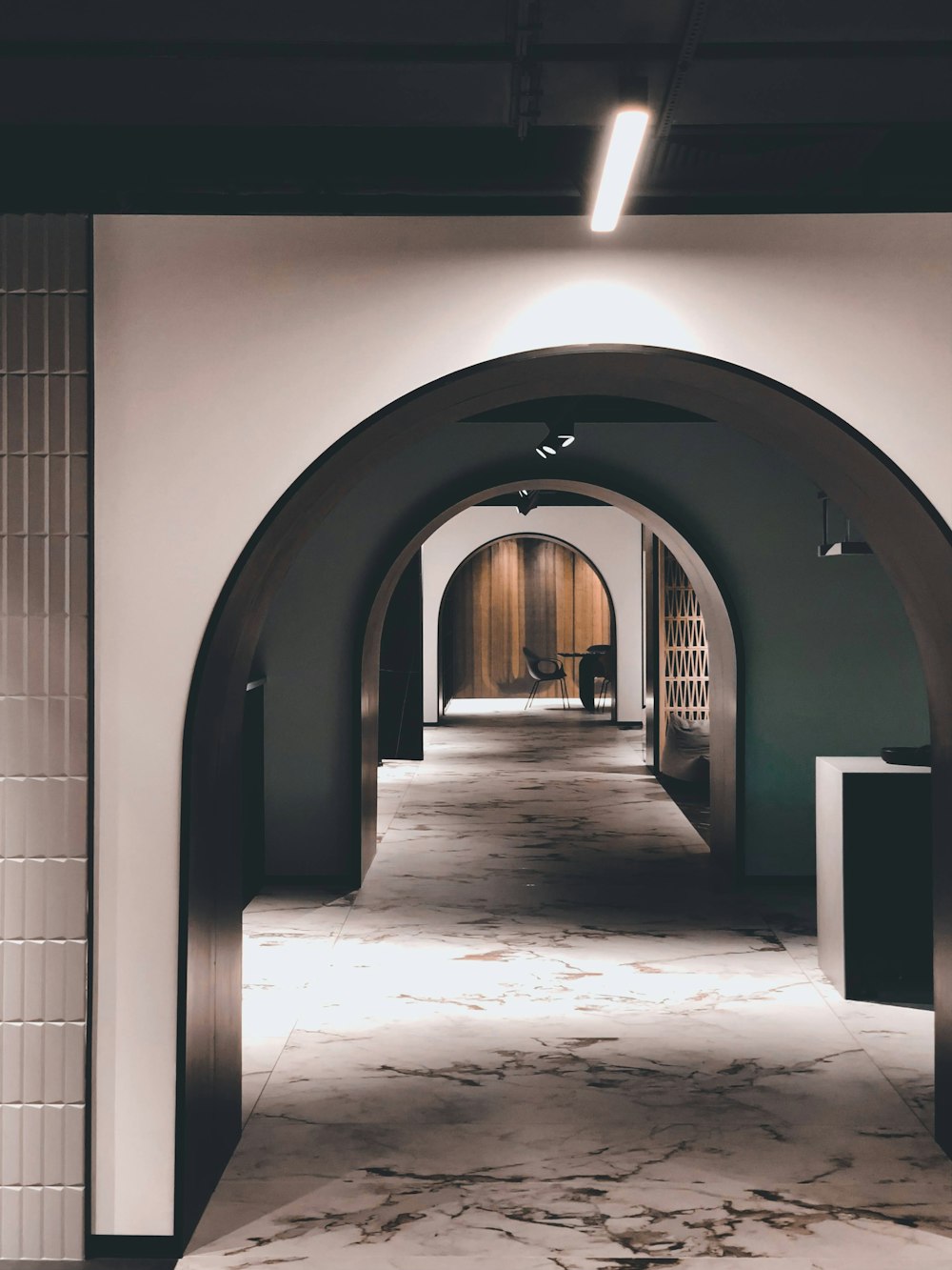 white and gray concrete hallway