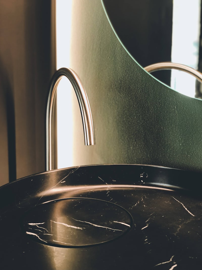 Black marble sink in bathroom