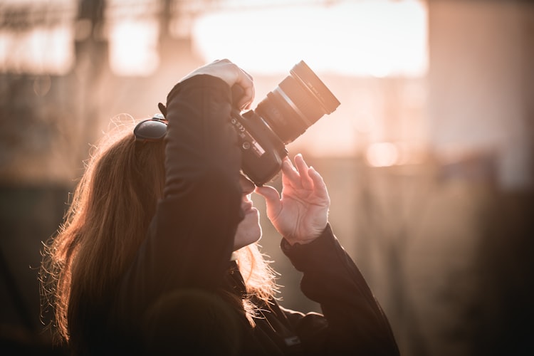 Photo of a photographer getting ready to take the perfect shot.