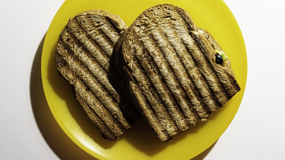 brown cookies on yellow plate