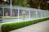white wooden fence near green grass field