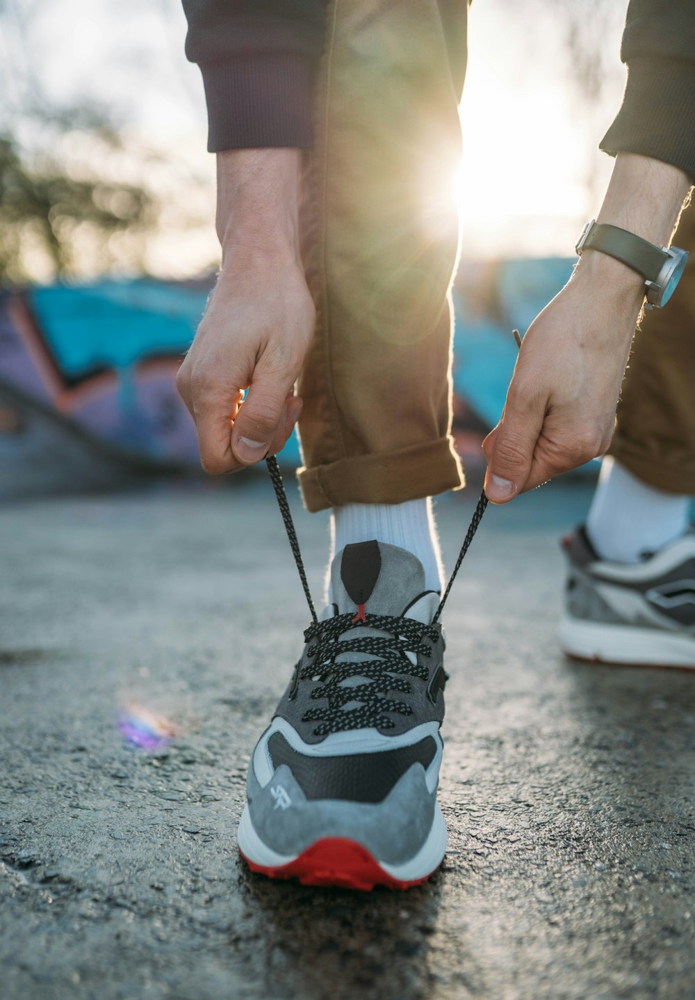 person holding black and white nike shoe