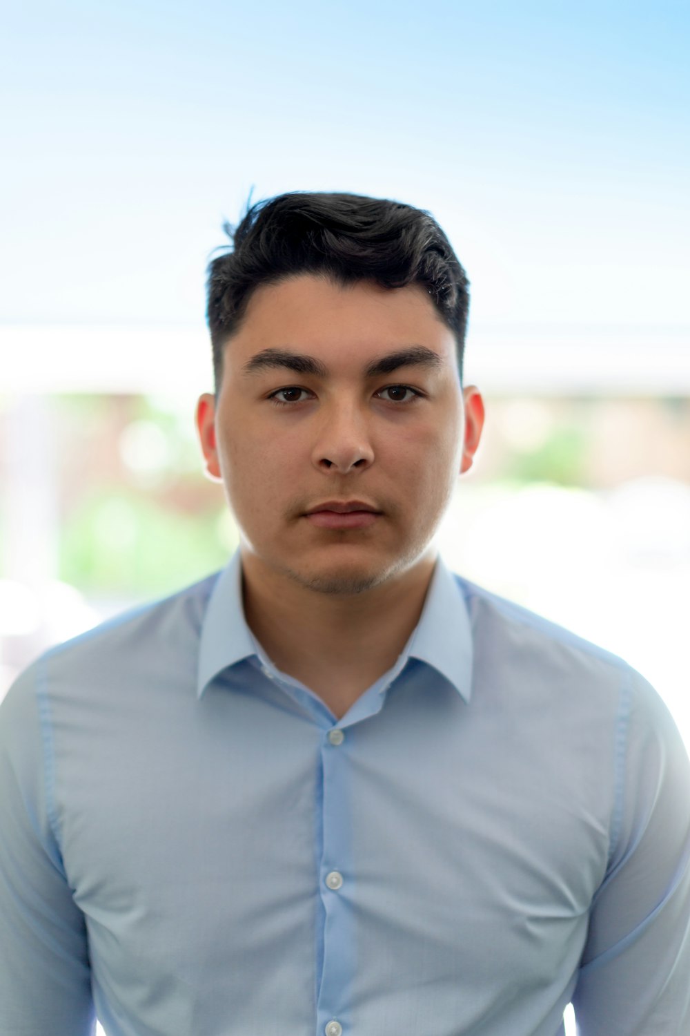 man in blue dress shirt