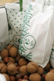 brown round fruits on white plastic bag