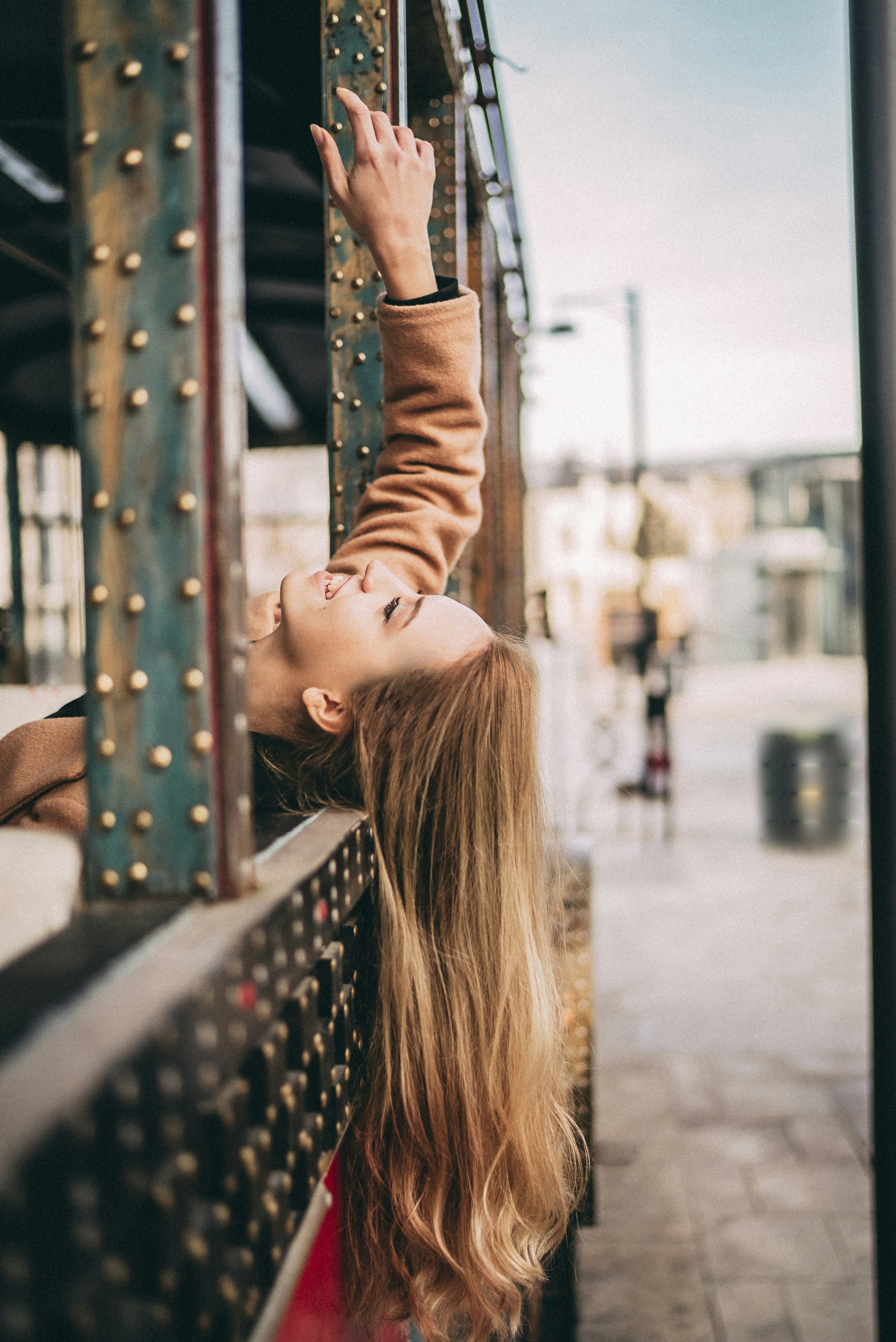 a woman wearing a caramel color wig in 24" length