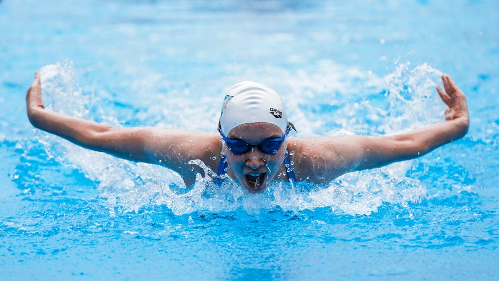 person in swimming goggles in water