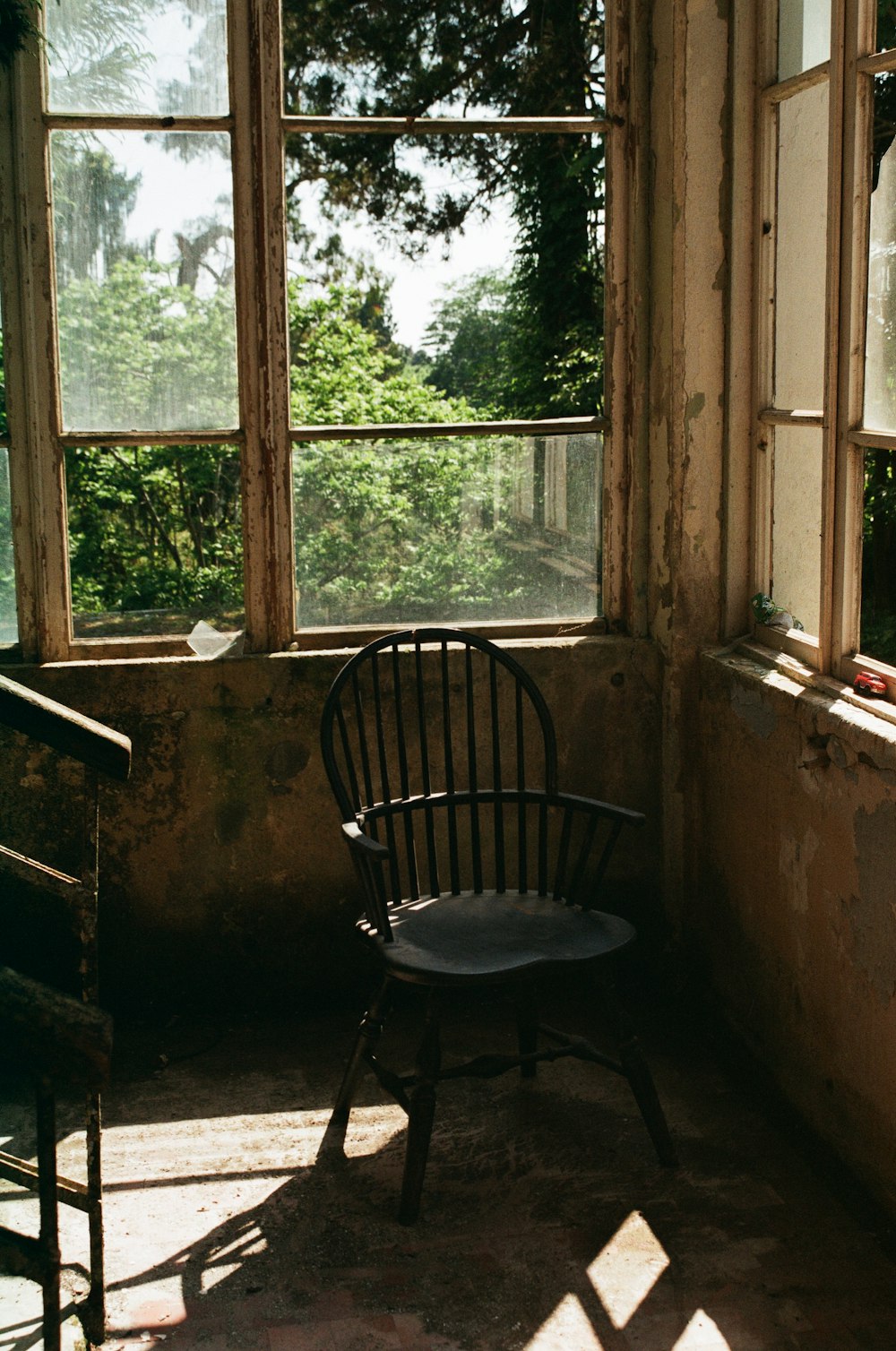 black metal chair near window