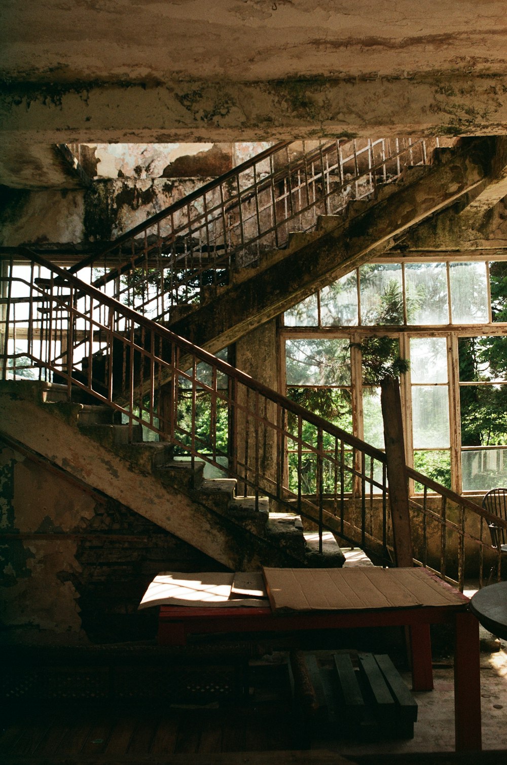 brown wooden table near brown wooden staircase