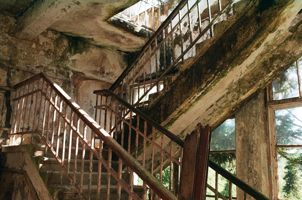 brown wooden staircase in a concrete building