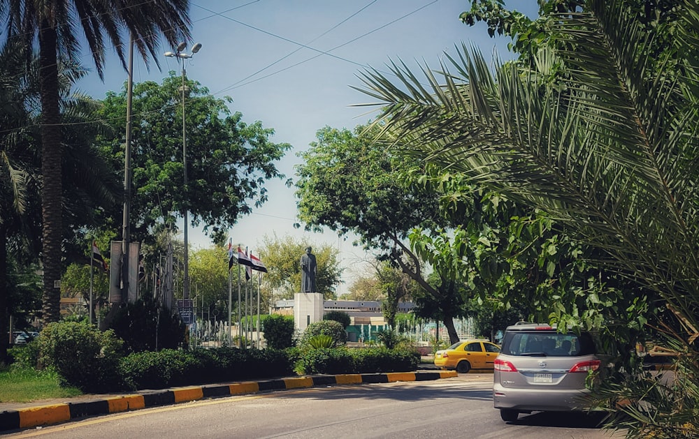 black sedan on road during daytime