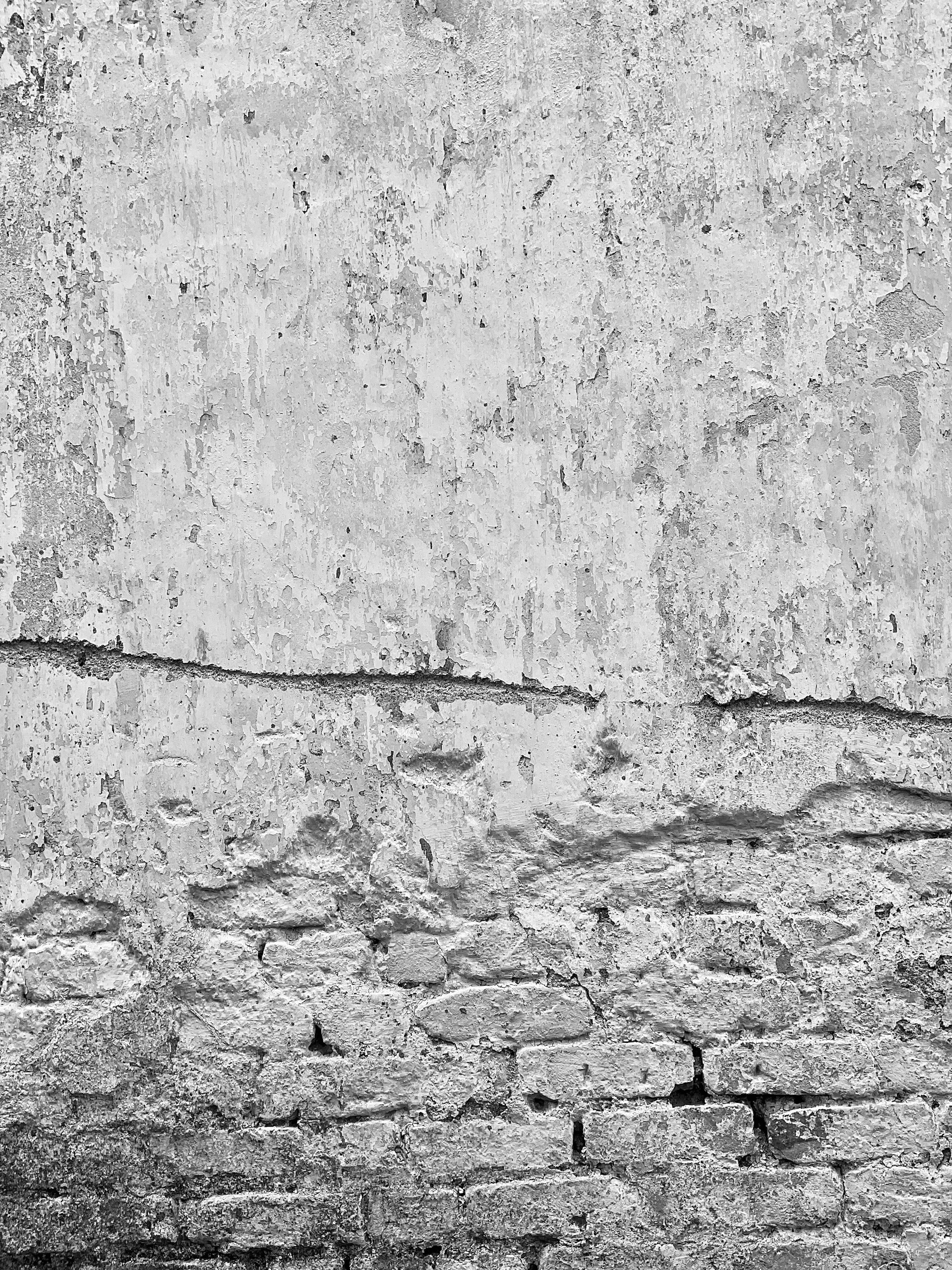 grayscale photo of concrete wall