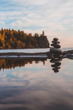 black stone on body of water during daytime