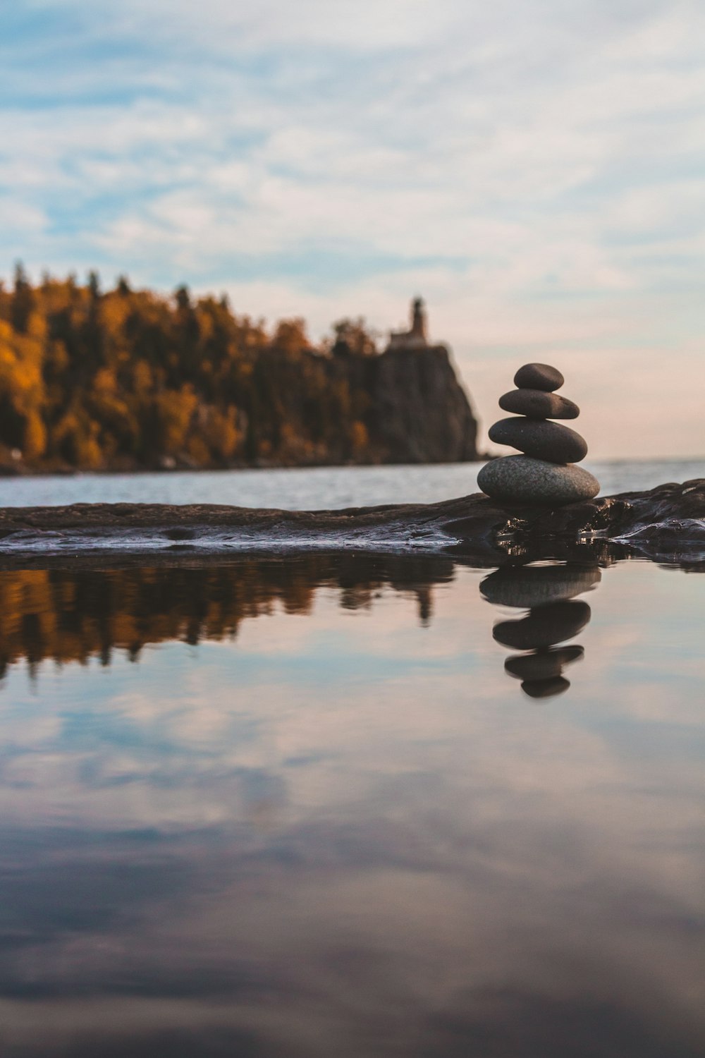 black stone on body of water during daytime