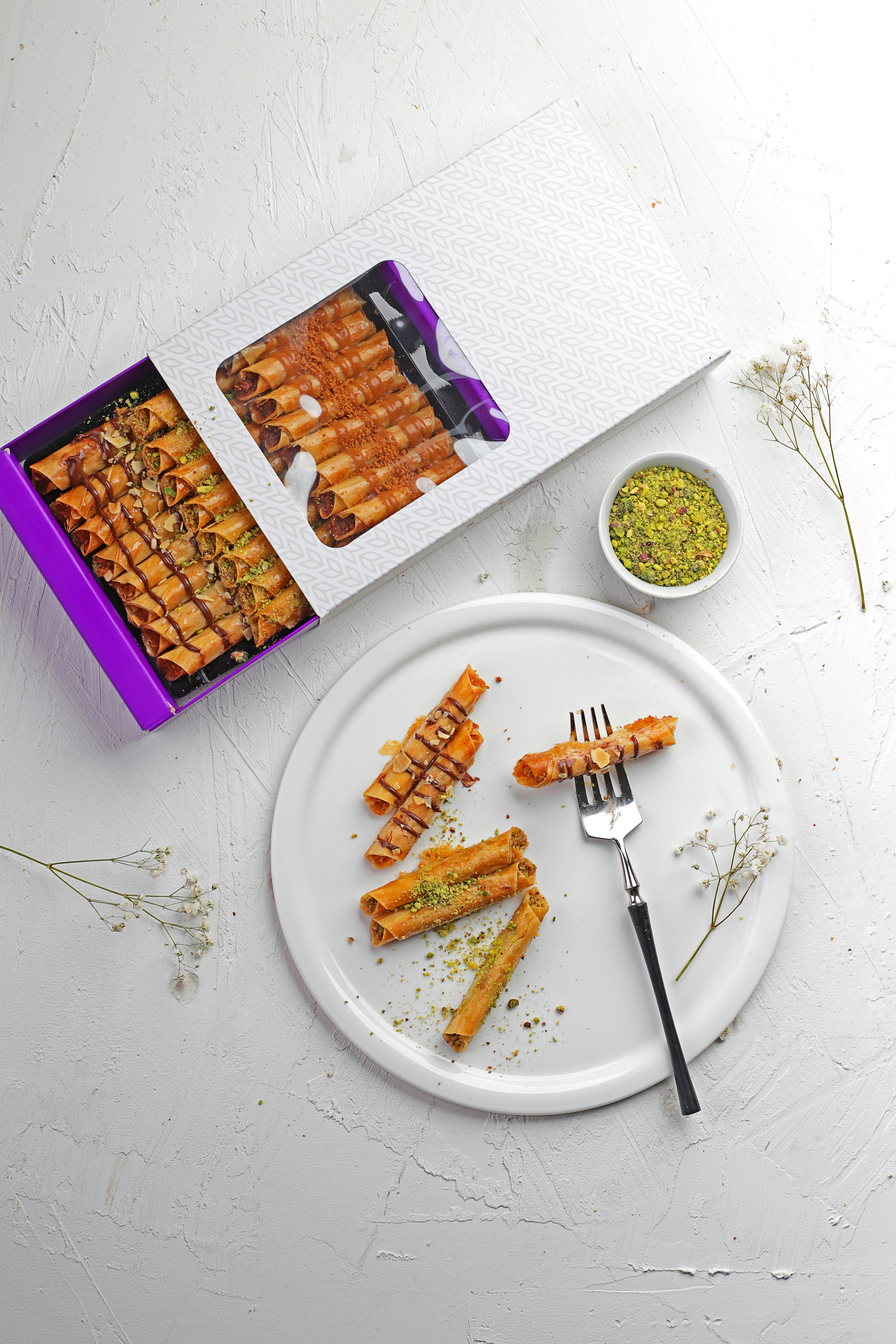 brown and purple biscuits on white ceramic plate