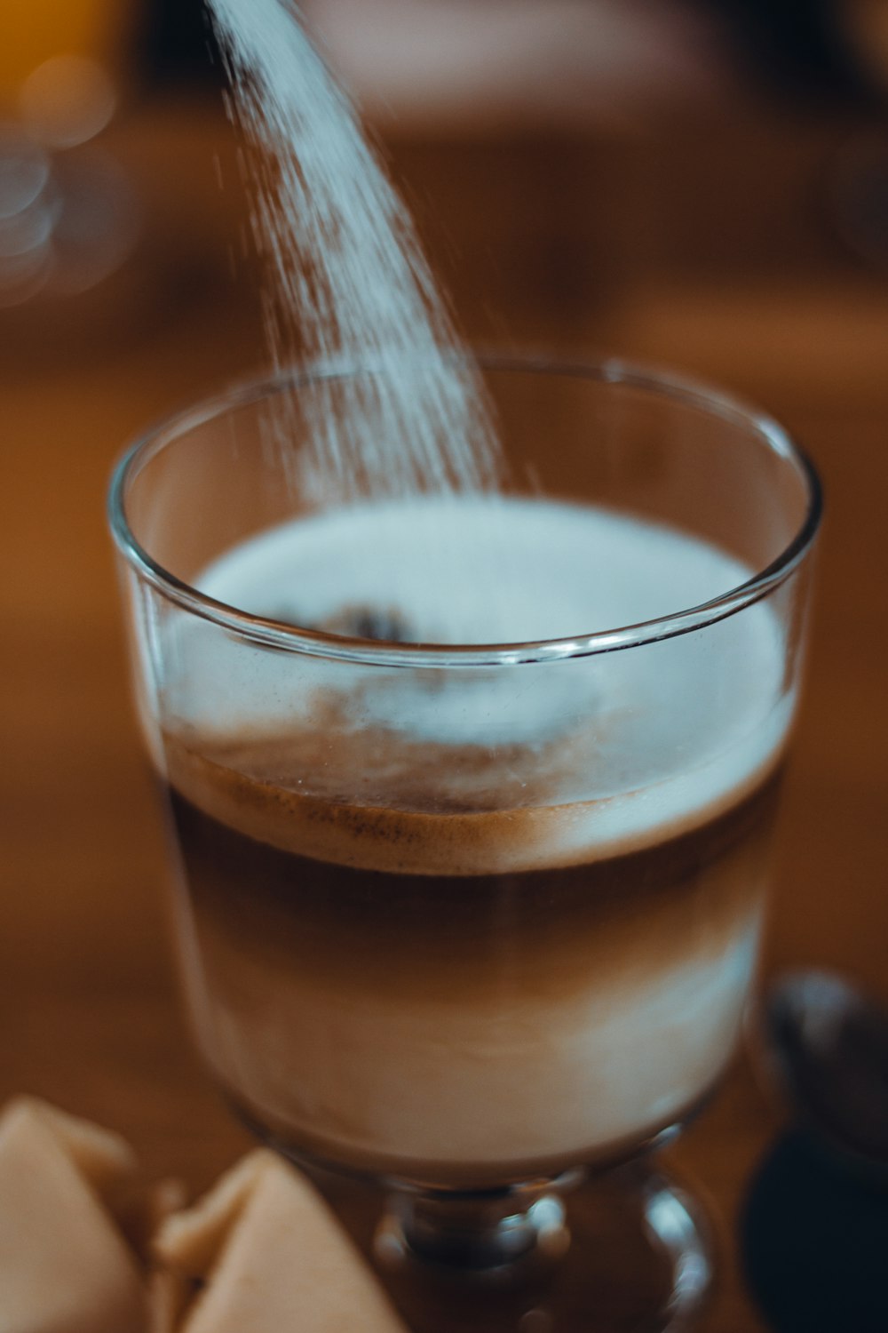 clear drinking glass with brown liquid