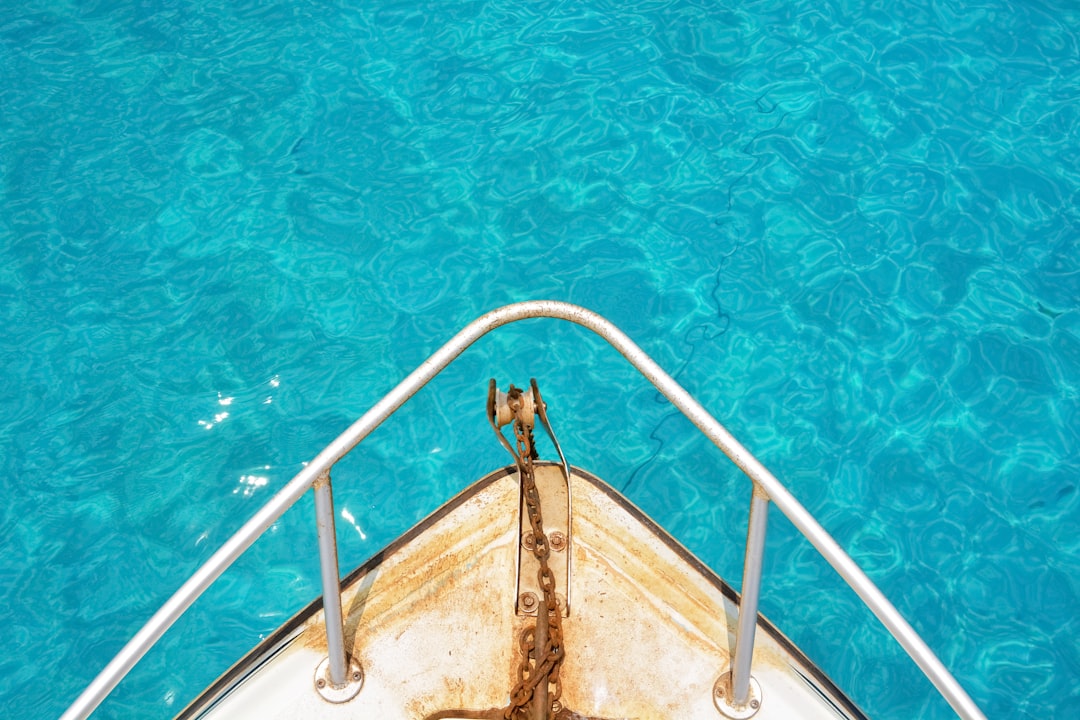 white boat on blue water